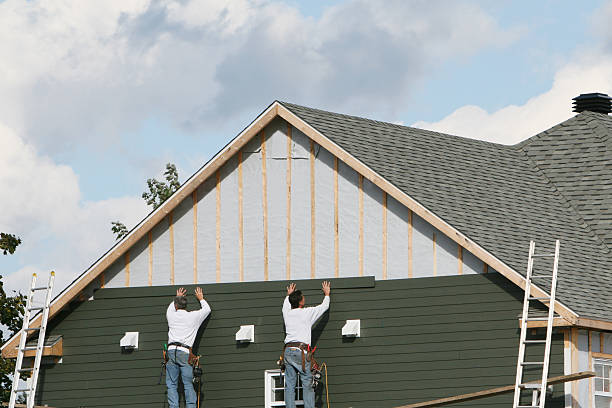 Professional Siding technician working in Louisville, OH